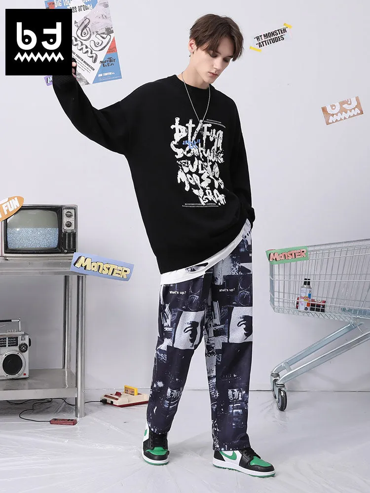 High-waisted, mid-length slacks full of letters and graffiti